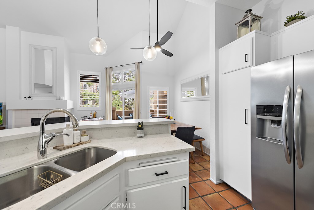 12 Bright Water Drive Dana Point, CA 92629 - Photo 9 of 24 a kitchen with a refrigerator sink and cabinets