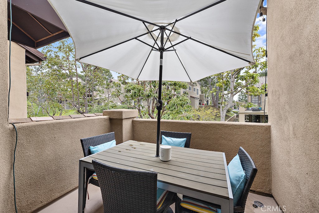 12 Bright Water Drive Dana Point, CA 92629 - Photo 10 of 24 a view of a patio with a table and chairs under an umbrella