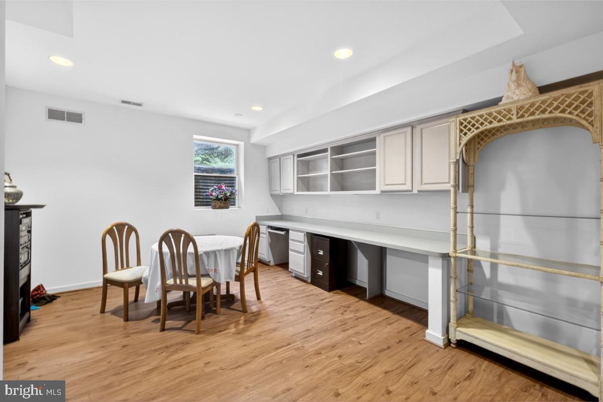 10320 Glen Road Potomac, MD 20854 - Photo 24 of 75 a view of a a dining room with furniture window and wooden floor