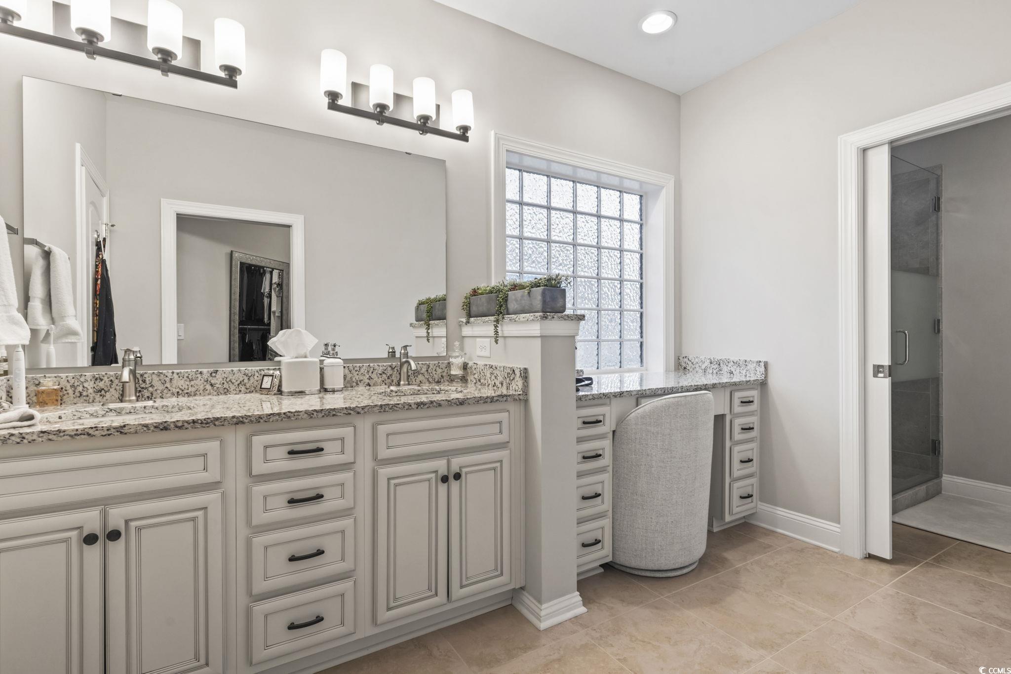 636 Elmwood Circle Murrells Inlet, SC 29576 - Photo 15 of 36 Full bath with double vanity, a shower stall, and light tile patterned floors