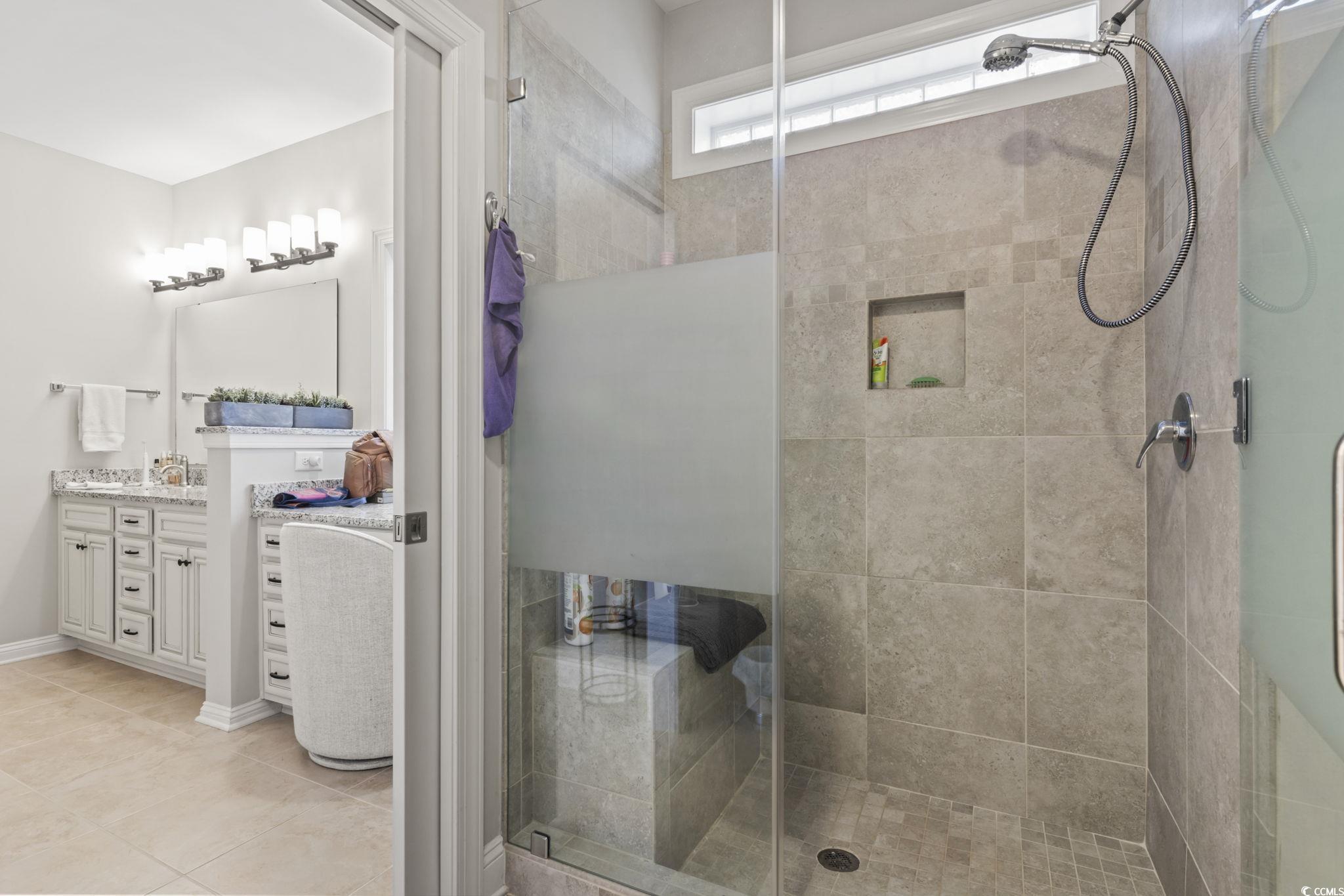 636 Elmwood Circle Murrells Inlet, SC 29576 - Photo 16 of 36 Full bathroom featuring vanity, a shower stall, and light tile patterned floors