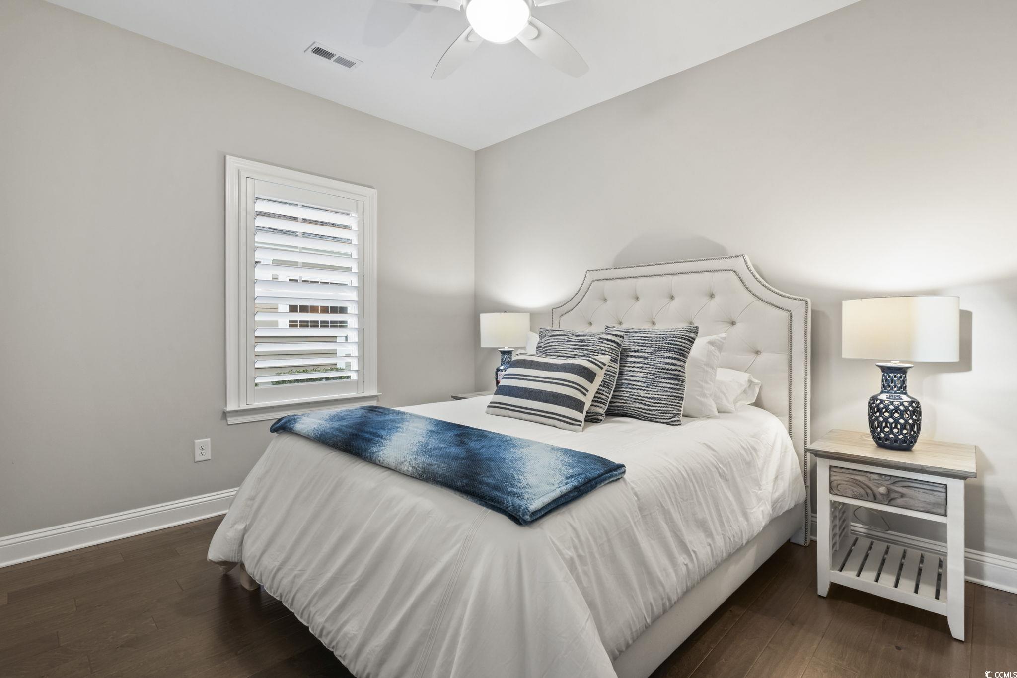636 Elmwood Circle Murrells Inlet, SC 29576 - Photo 18 of 36 Bedroom featuring dark wood finished floors and ceiling fan