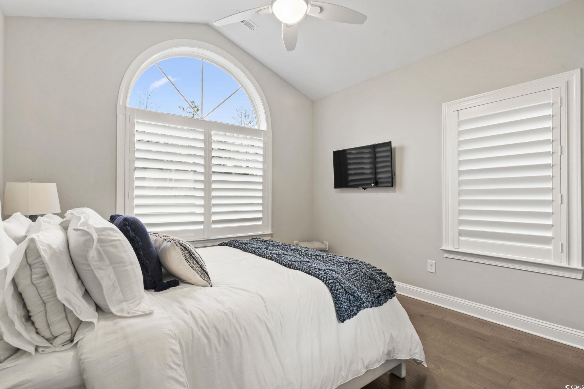 636 Elmwood Circle Murrells Inlet, SC 29576 - Photo 20 of 36 Bedroom with lofted ceiling, dark wood-style flooring, and ceiling fan