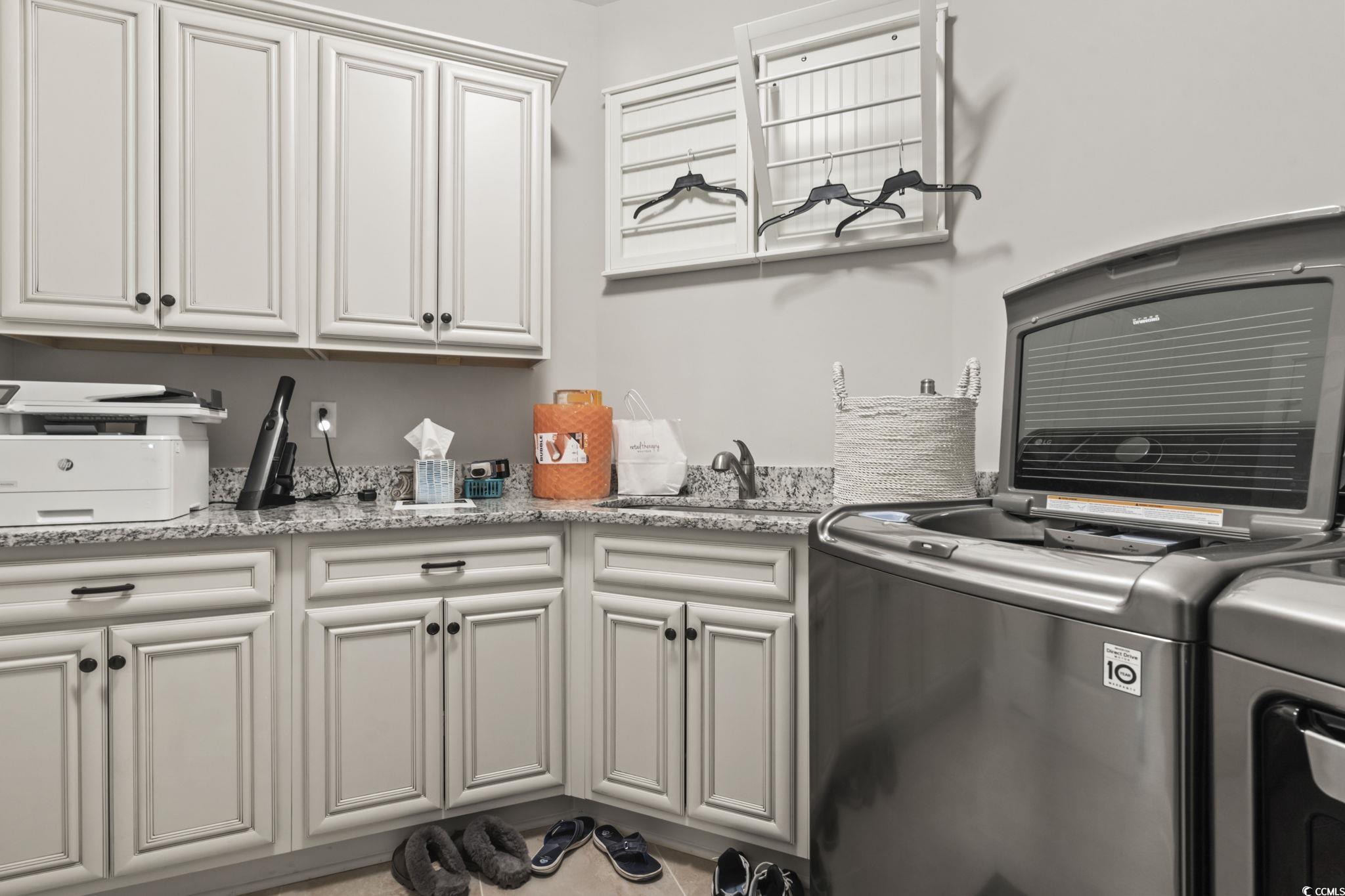 636 Elmwood Circle Murrells Inlet, SC 29576 - Photo 21 of 36 Laundry area with washing machine and dryer and cabinet space