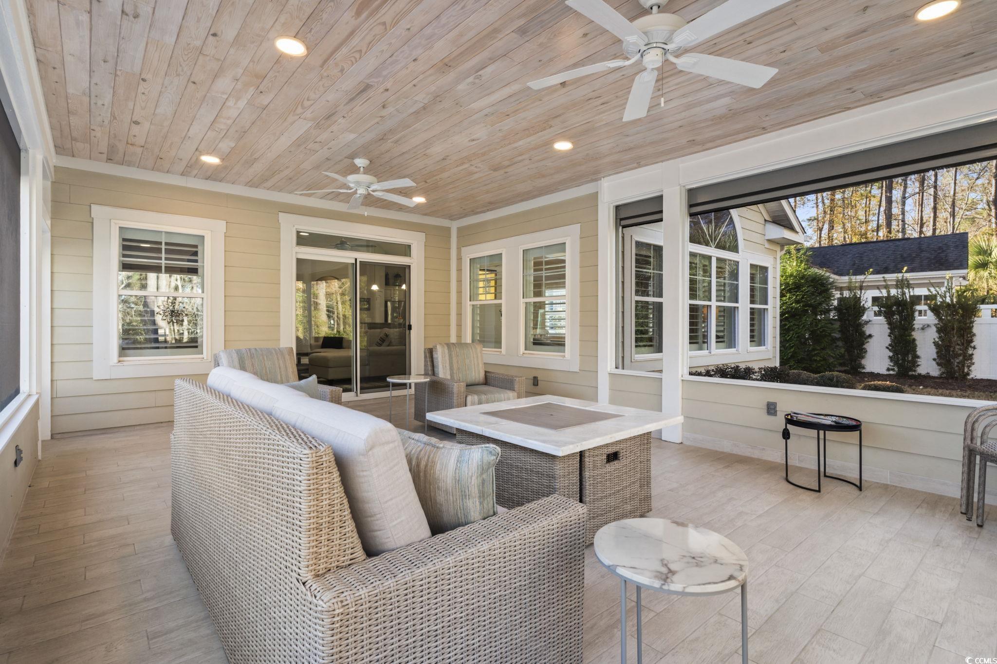 636 Elmwood Circle Murrells Inlet, SC 29576 - Photo 23 of 36 Sunroom / solarium with ceiling fan and outdoor lounge area