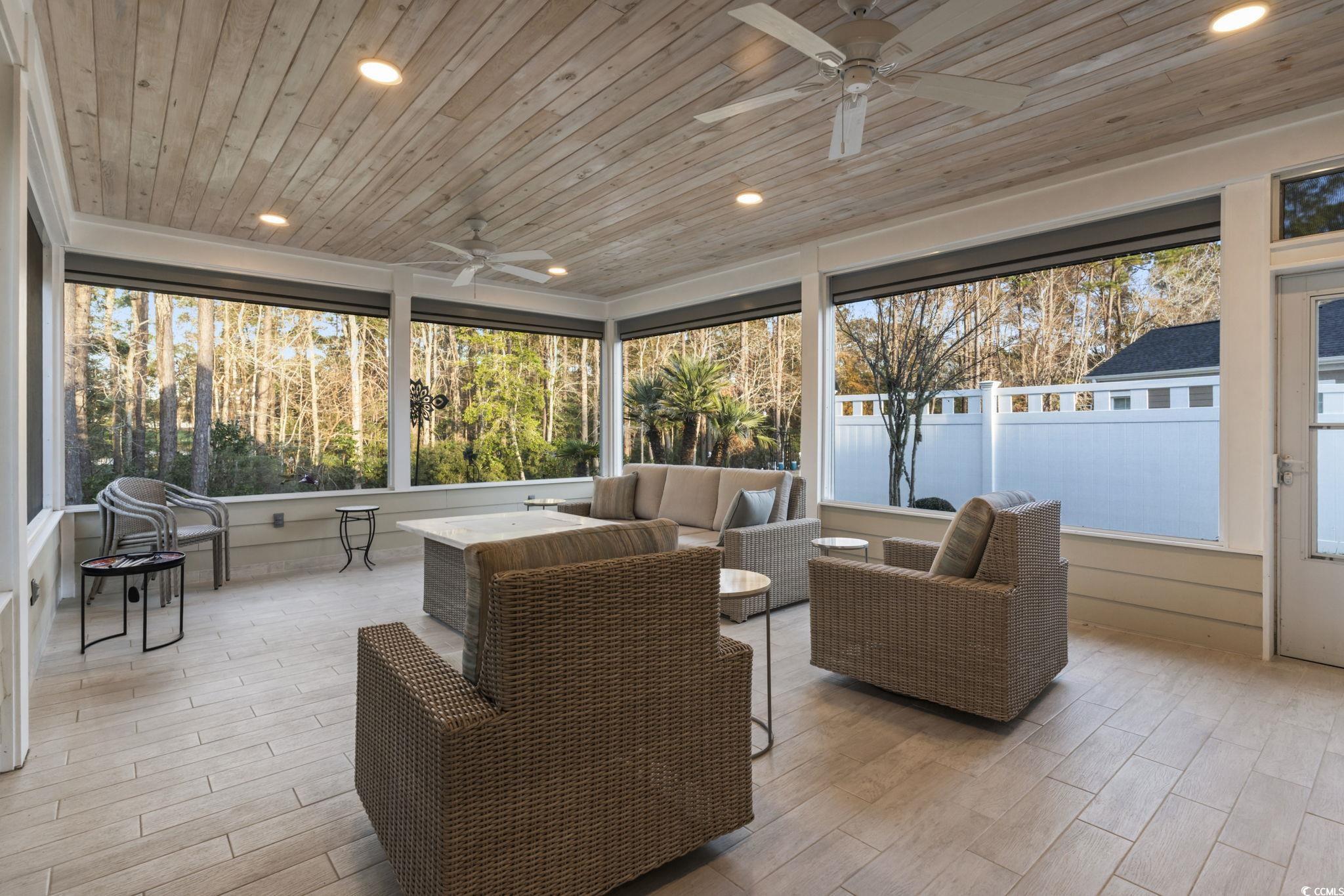 636 Elmwood Circle Murrells Inlet, SC 29576 - Photo 24 of 36 Sunroom featuring an outdoor living space and a ceiling fan
