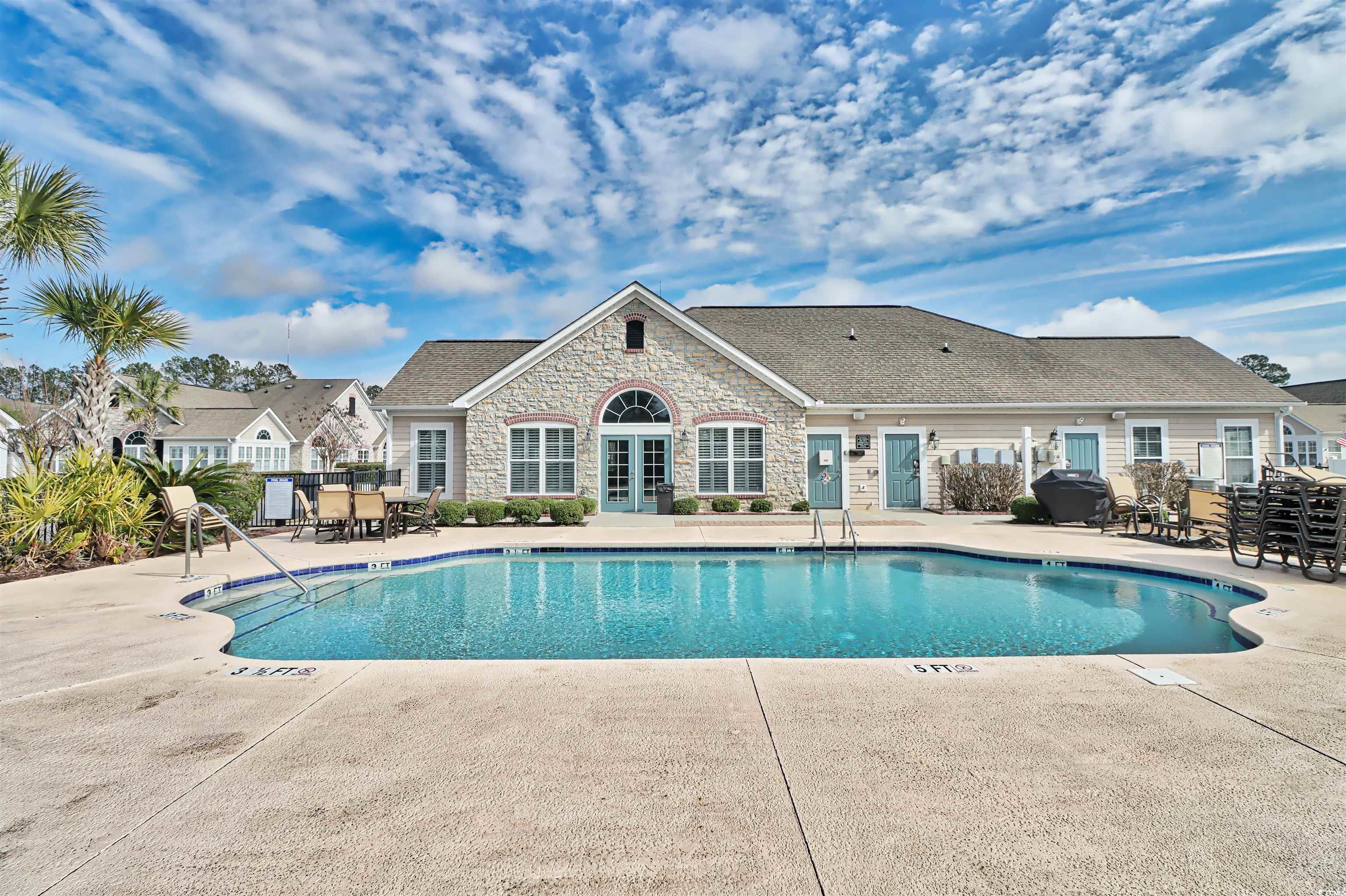 636 Elmwood Circle Murrells Inlet, SC 29576 - Photo 35 of 36 Community pool with a patio area and french doors