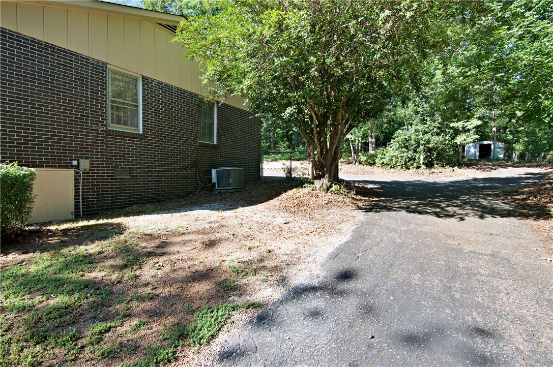 102 Broad Street Clemson, SC 29631 - Photo 32 of 40 A classic brick exterior blends seamlessly with the natural, wooded surroundings.