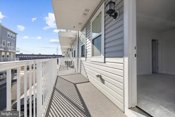 a view of a balcony with wooden floor