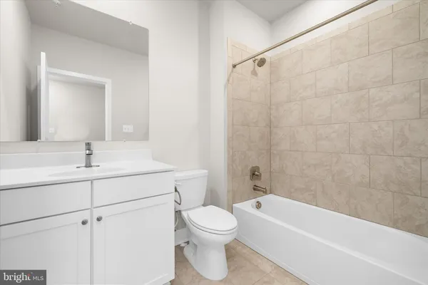 a bathroom with a shower and a toilet