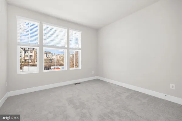an empty room with closet area