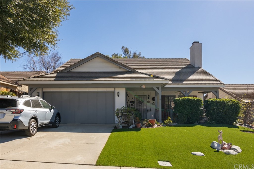 33710 Canyon Ranch Road Wildomar, CA 92595 - Photo 1 of 1 a front view of a house with garden