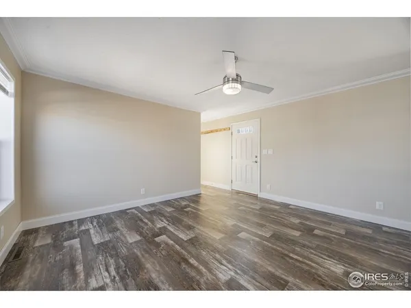 a view of an empty room and a window
