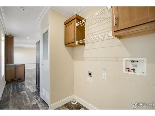 a view of an entryway with wooden floor
