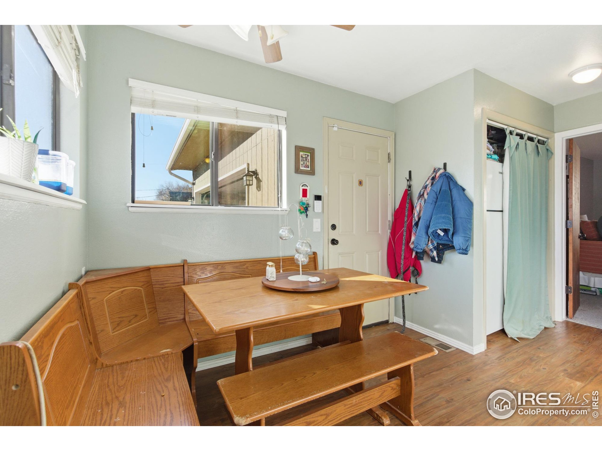 7905 3rd Street Wellington, CO 80549 - Photo 11 of 25 a view of a dining room with furniture and a kitchen