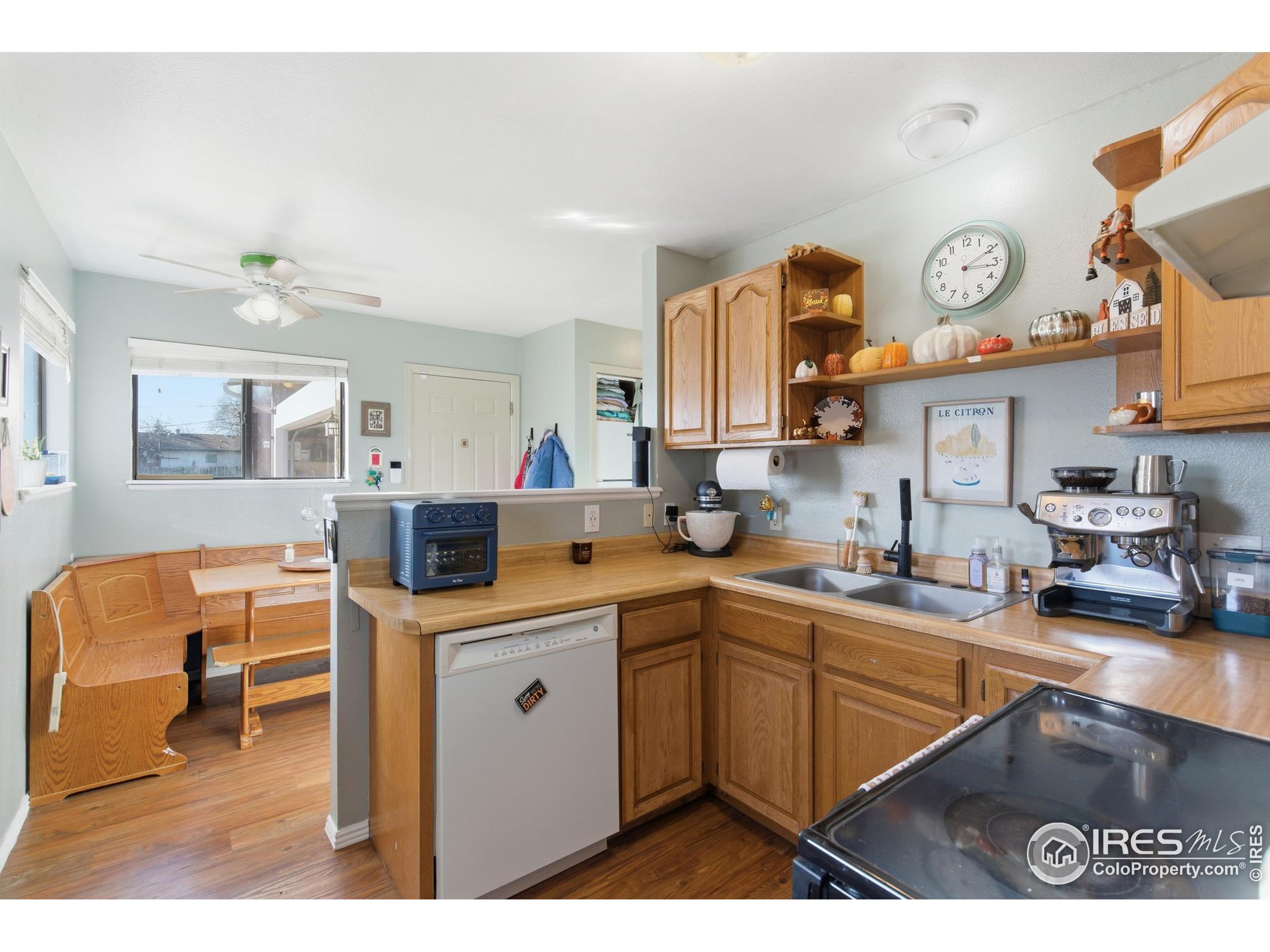 7905 3rd Street Wellington, CO 80549 - Photo 13 of 25 a kitchen with stainless steel appliances a sink a stove and cabinets