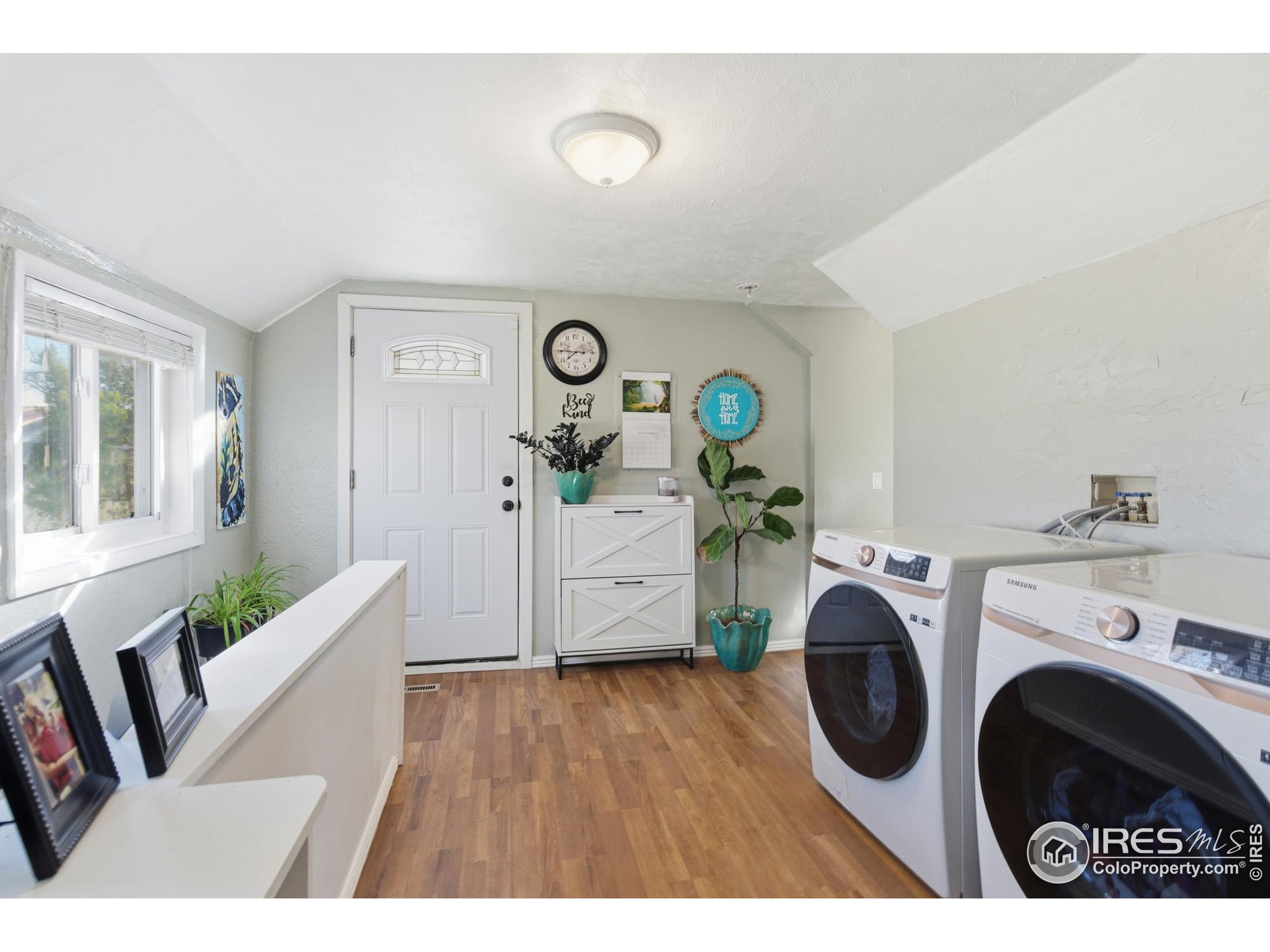 7905 3rd Street Wellington, CO 80549 - Photo 16 of 25 a view of a hallway with washer and dryer