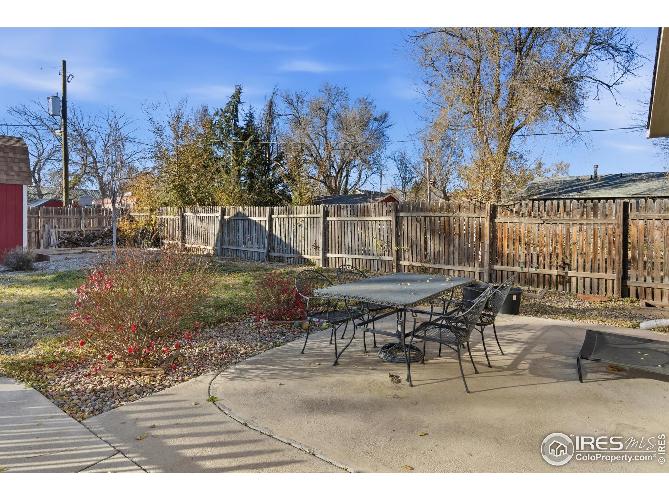 7905 3rd Street Wellington, CO 80549 - Photo 19 of 25 a backyard of a house with table and chairs