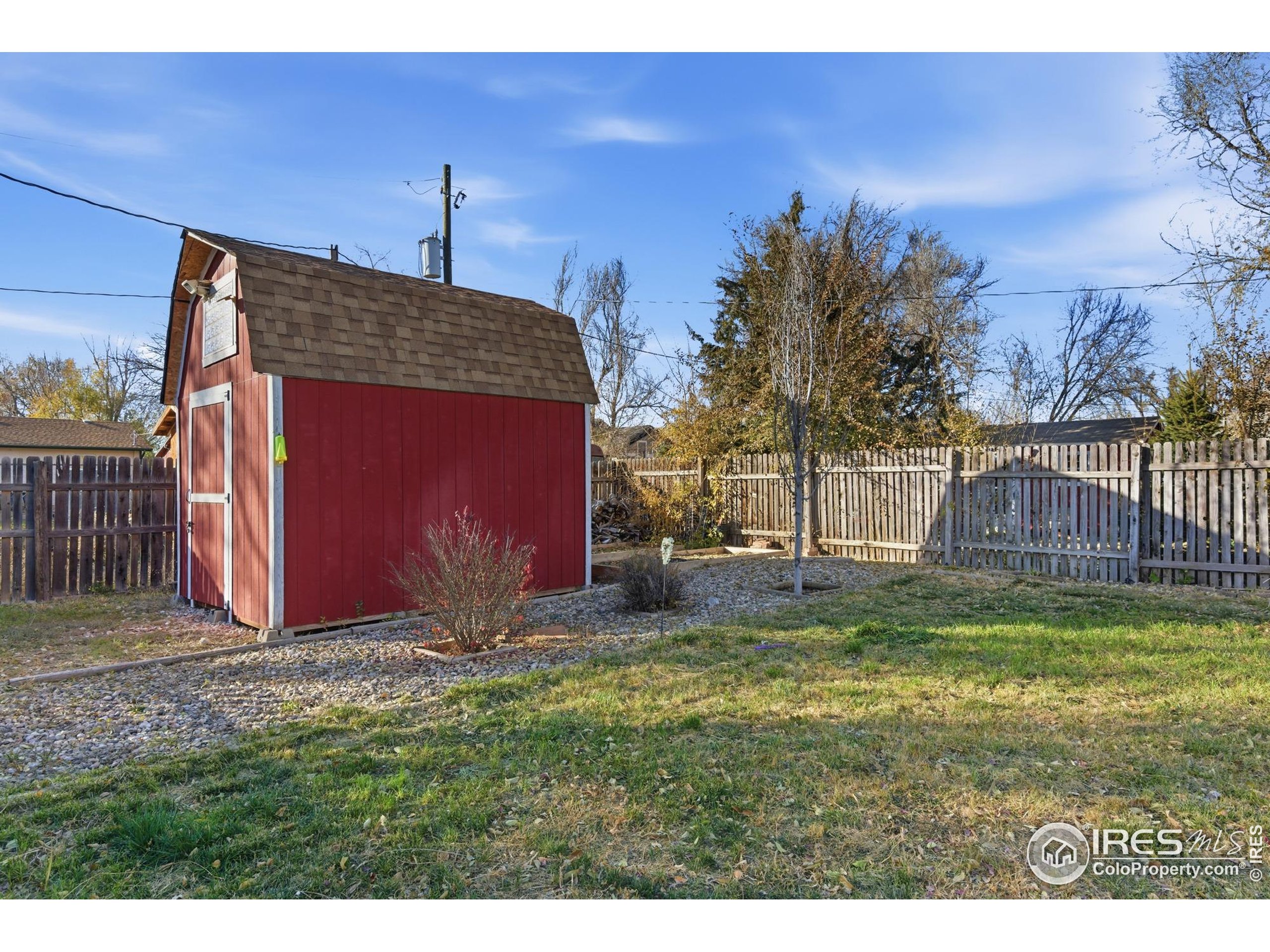 7905 3rd Street Wellington, CO 80549 - Photo 23 of 25 a backyard of a house with table and chairs