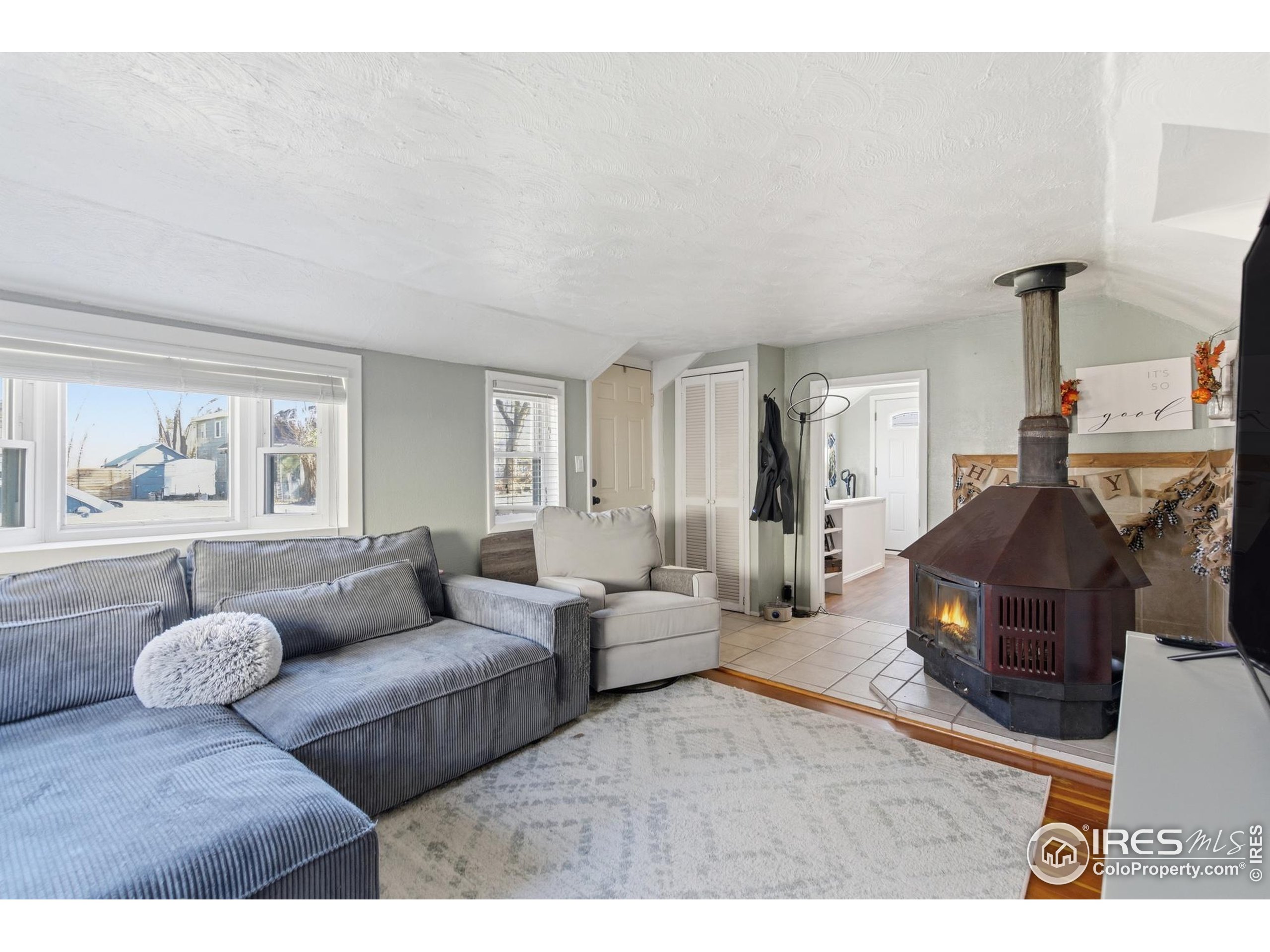 7905 3rd Street Wellington, CO 80549 - Photo 4 of 25 a living room with furniture and a large window