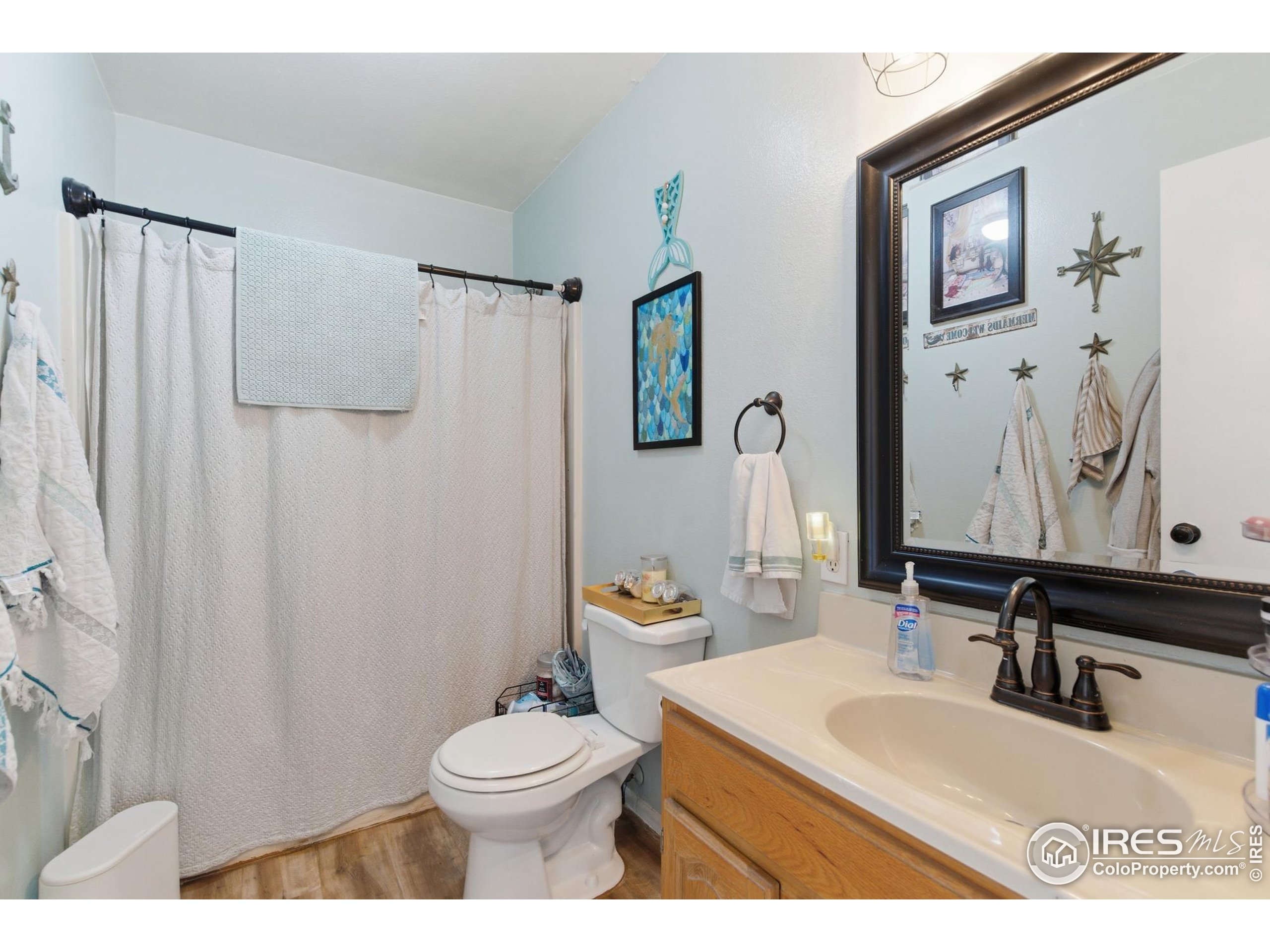 7905 3rd Street Wellington, CO 80549 - Photo 8 of 25 a bathroom with a sink toilet and shower