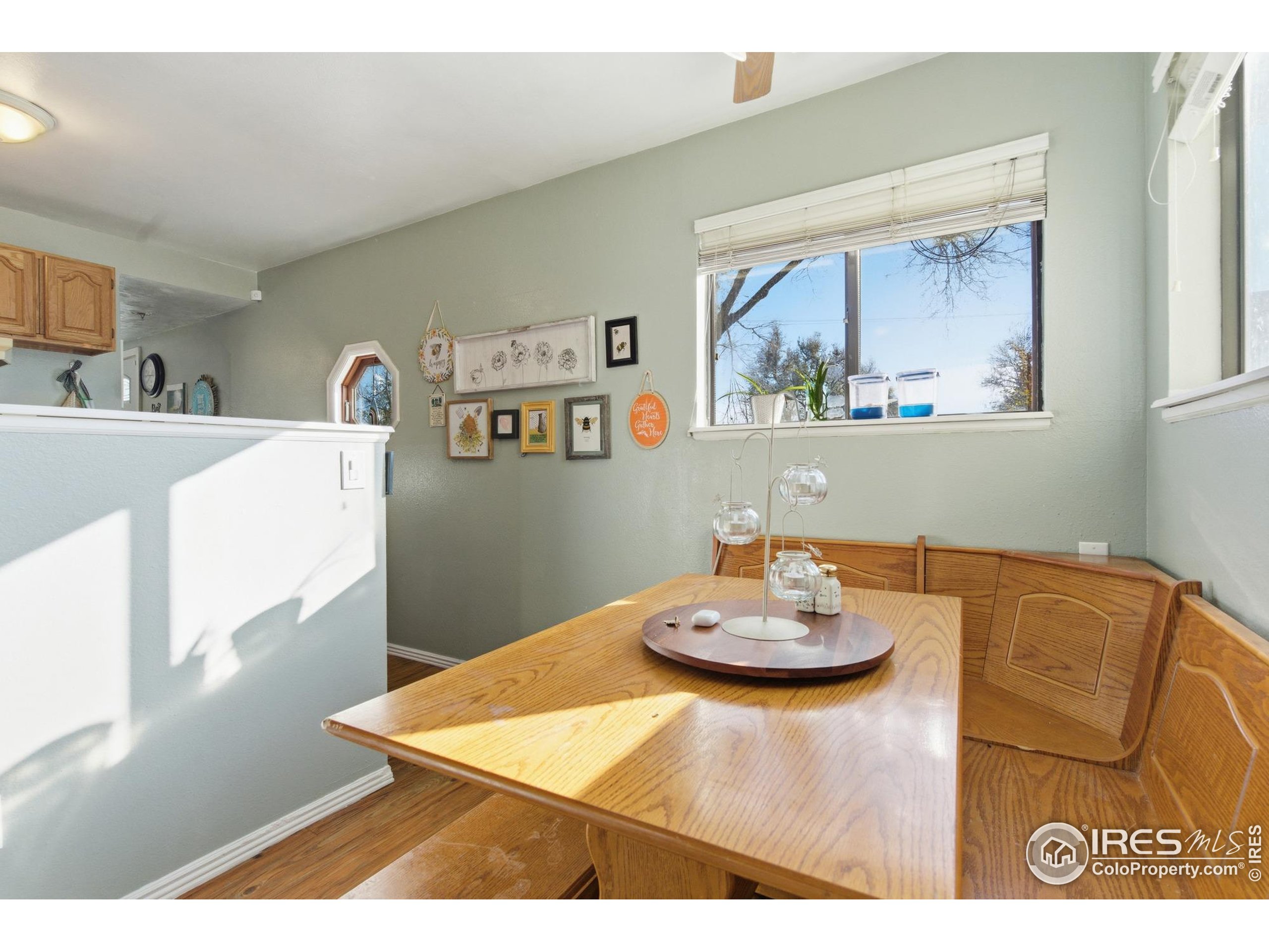 7905 3rd Street Wellington, CO 80549 - Photo 10 of 25 a view of a dining room with furniture and a chandelier