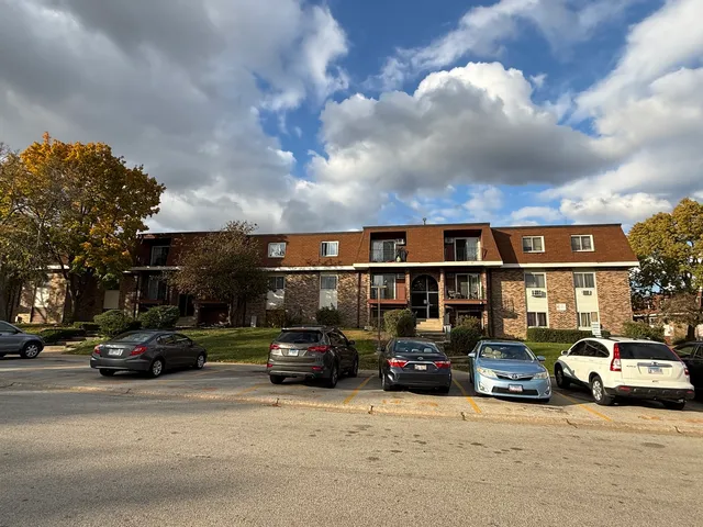 a view of cars parked in front of a building