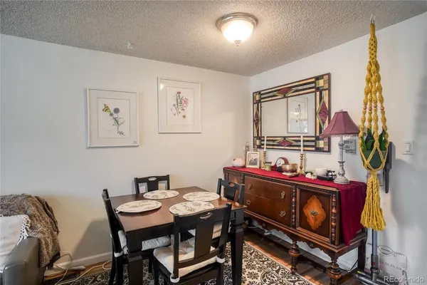 a dining room with furniture and window