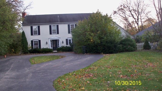 1209 West Deerpath Road Lake Forest, IL 60045 - Photo 1 of 1 a view of a house with a yard
