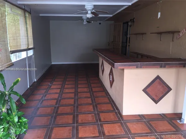 a hallway with a black white checkered floor