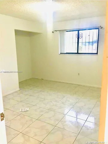 a view of a room with windows