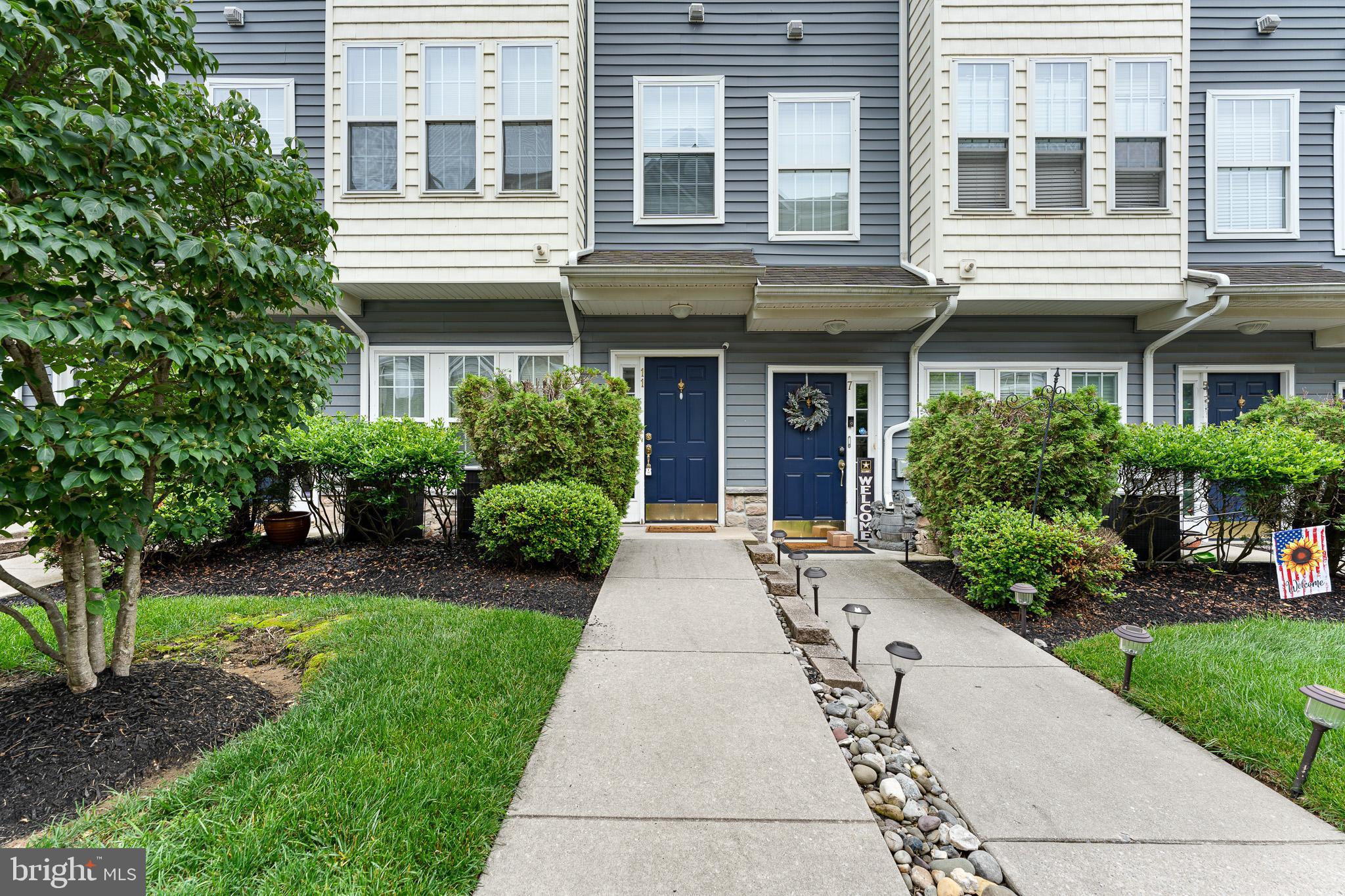 11 Teal Court Riverside, NJ 08075 - Photo 1 of 33 a front view of a building with garden