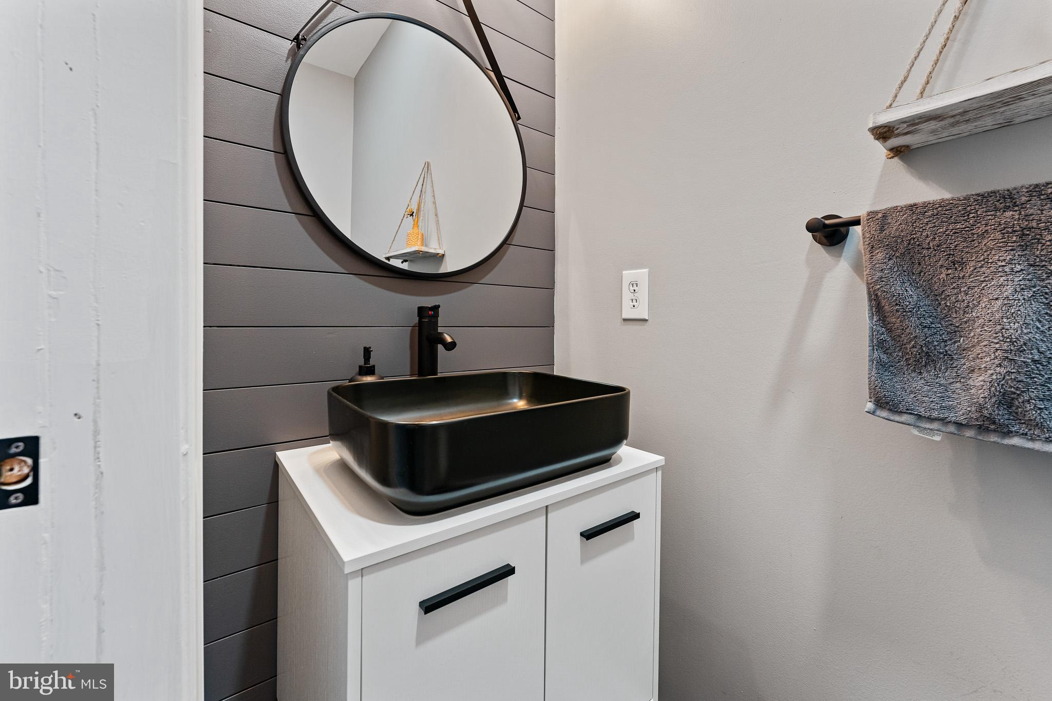 11 Teal Court Riverside, NJ 08075 - Photo 11 of 33 a bathroom with a sink and a mirror