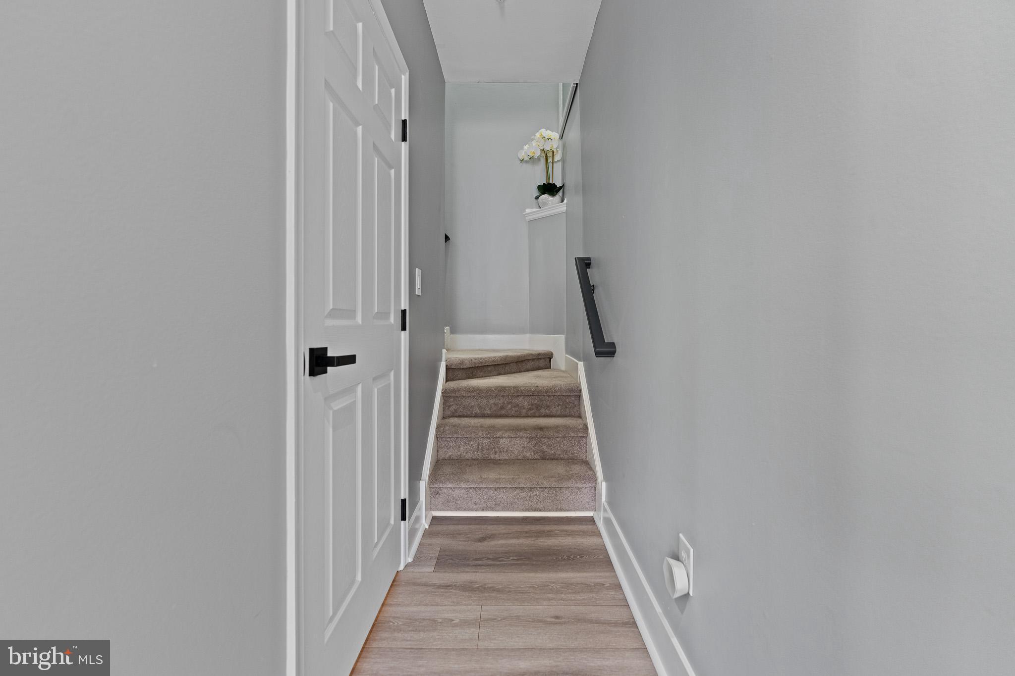 11 Teal Court Riverside, NJ 08075 - Photo 13 of 33 a view of a hallway with wooden floor and staircase