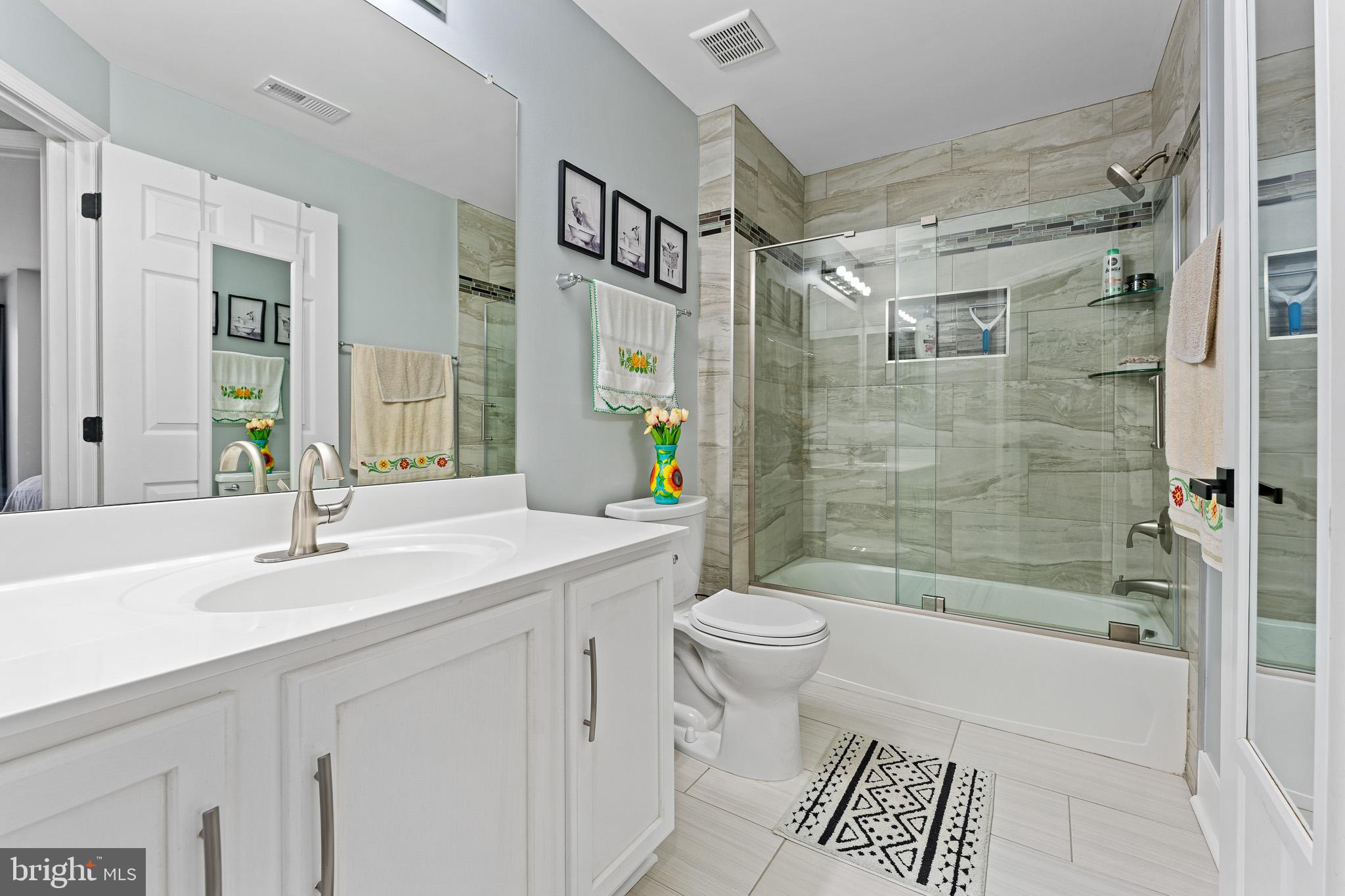 11 Teal Court Riverside, NJ 08075 - Photo 15 of 33 a bathroom with a sink toilet and shower