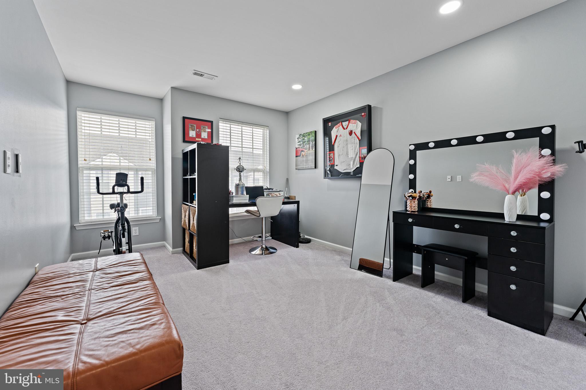 11 Teal Court Riverside, NJ 08075 - Photo 16 of 33 a bedroom with a bed and a flat tv screen on the dresser