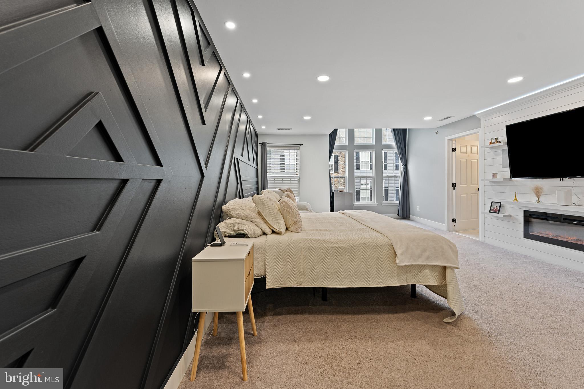 11 Teal Court Riverside, NJ 08075 - Photo 17 of 33 a spacious bedroom with a bed a flat screen tv and a sink