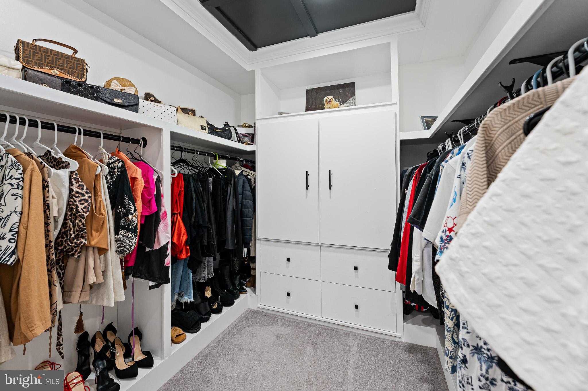 11 Teal Court Riverside, NJ 08075 - Photo 18 of 33 a view of walk in closet with clothes and shoes