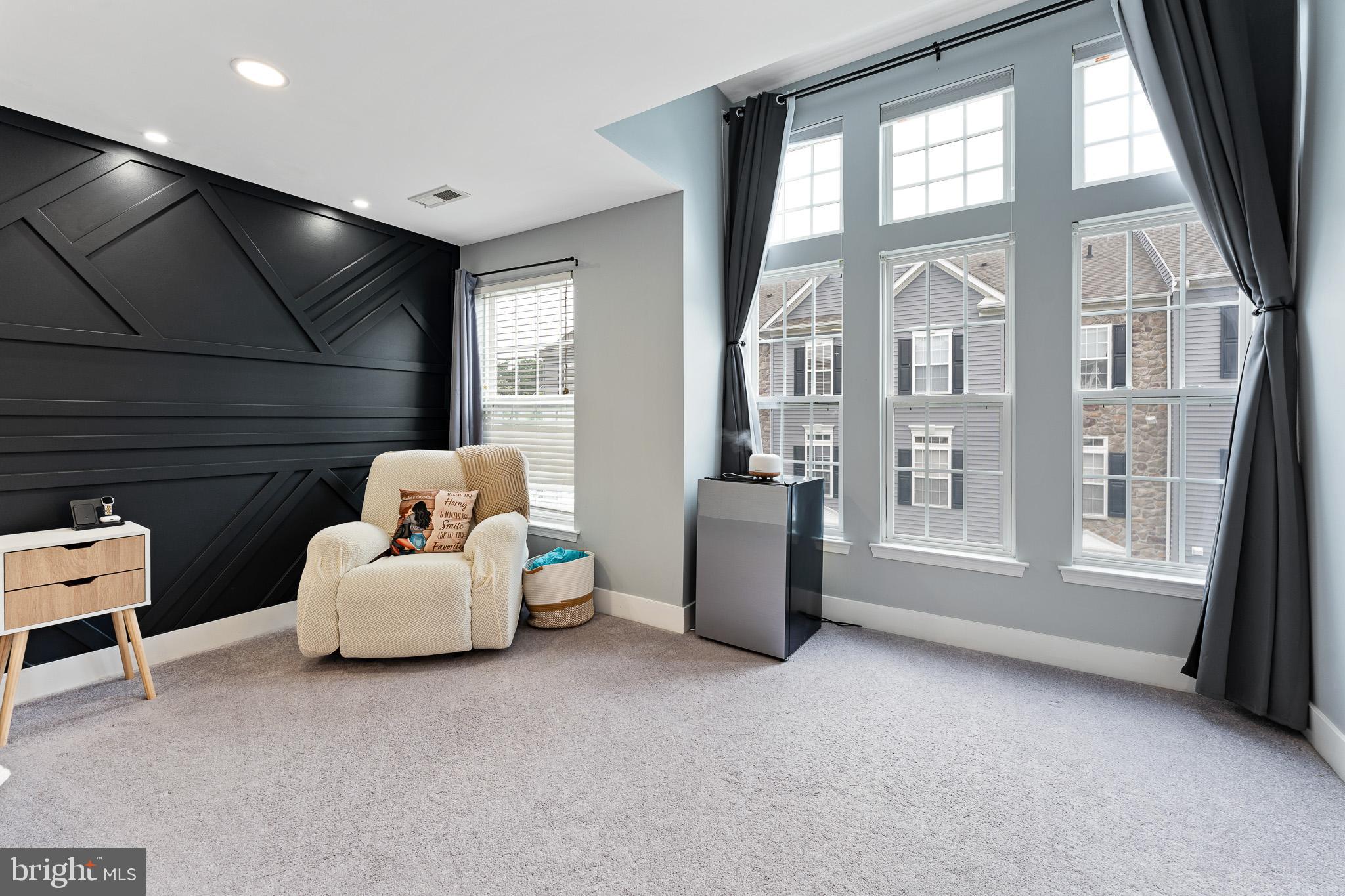 11 Teal Court Riverside, NJ 08075 - Photo 22 of 33 a living room with furniture and a floor to ceiling window