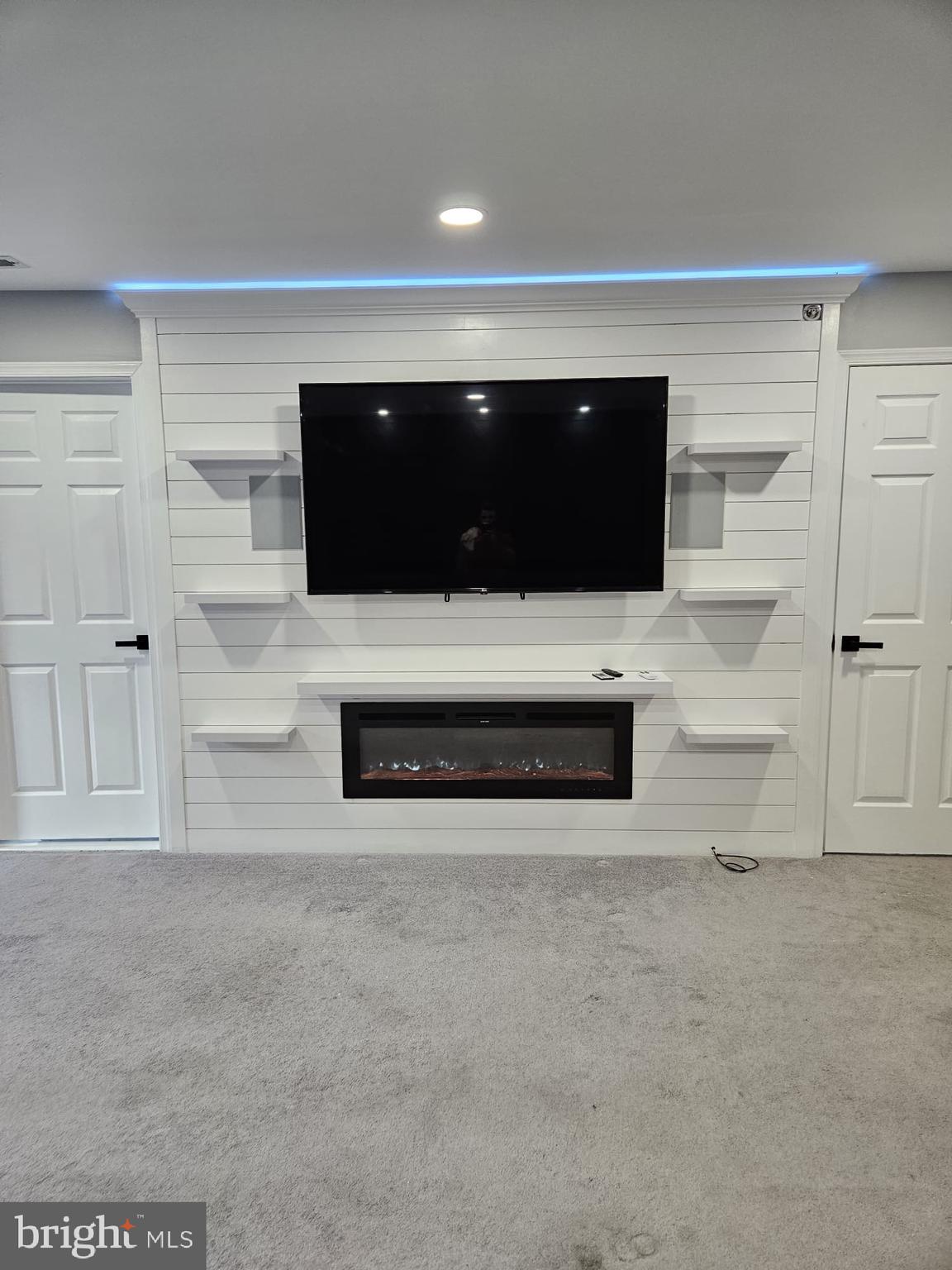 11 Teal Court Riverside, NJ 08075 - Photo 23 of 33 a living room with a flat screen tv and white wall