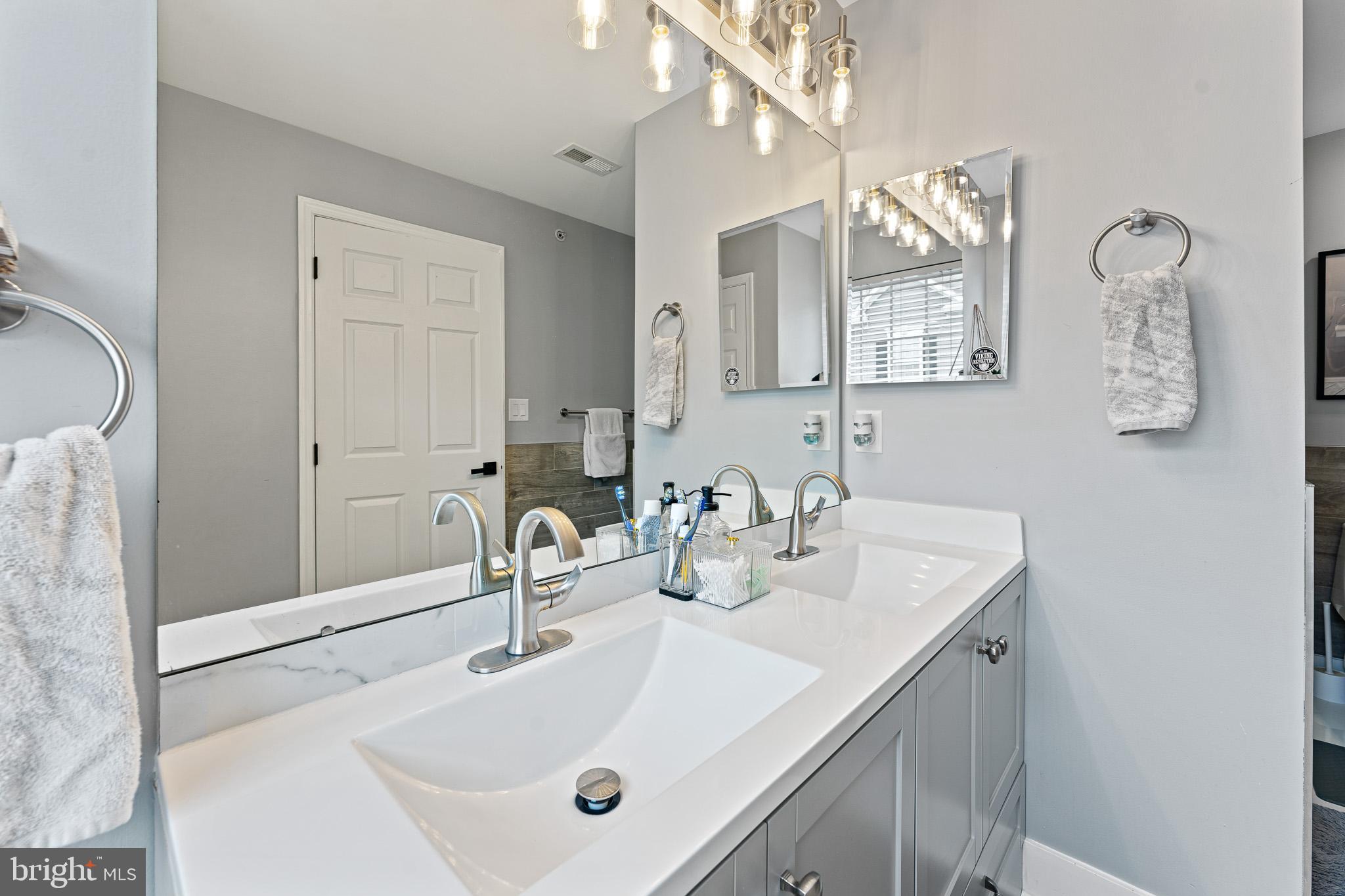 11 Teal Court Riverside, NJ 08075 - Photo 26 of 33 a bathroom with a sink and a mirror