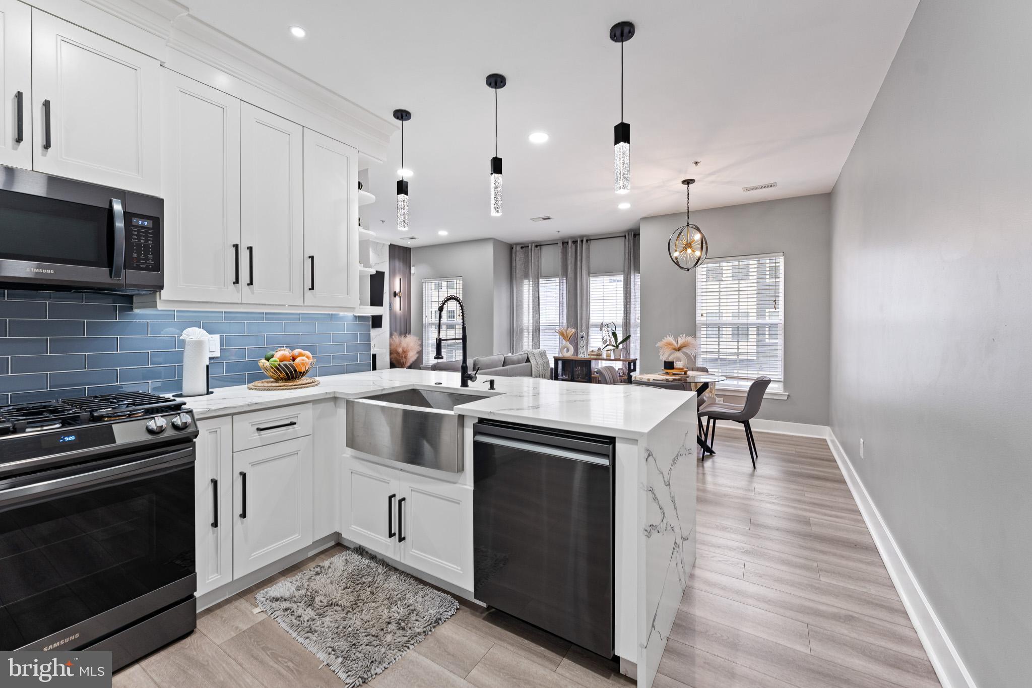 11 Teal Court Riverside, NJ 08075 - Photo 5 of 33 a kitchen with a sink stove and microwave