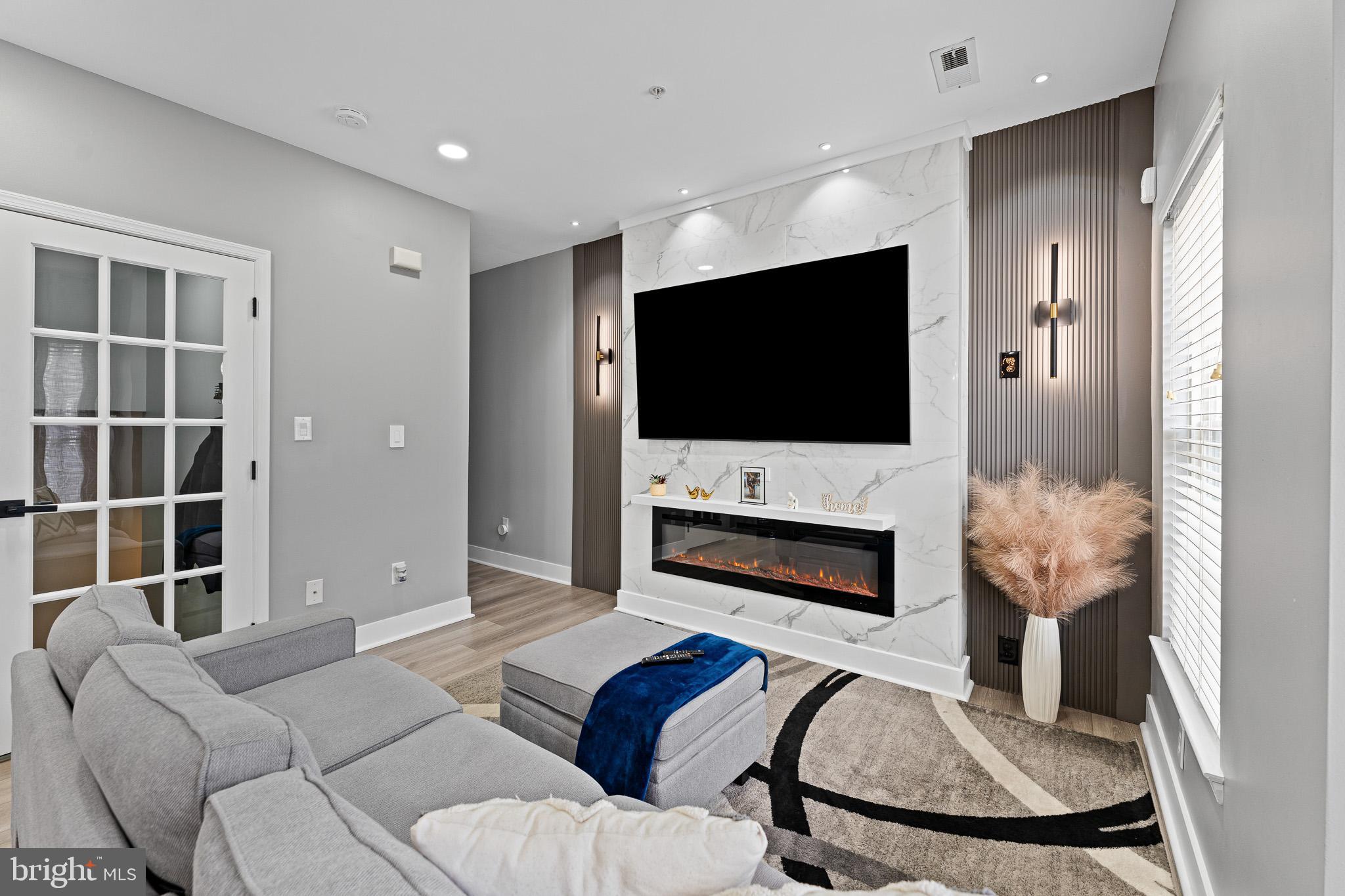 11 Teal Court Riverside, NJ 08075 - Photo 10 of 33 a living room with furniture and a flat screen tv