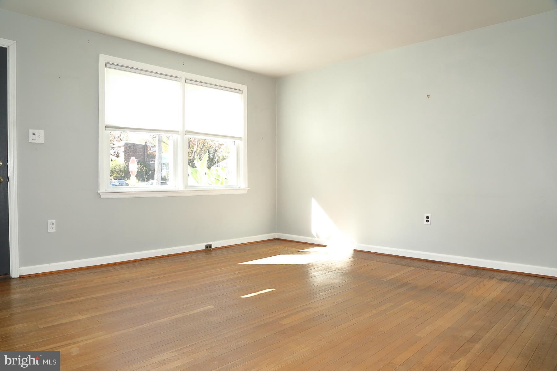 303 Euclid Avenue Lancaster, PA 17603 - Photo 15 of 24 an empty room with wooden floor and windows