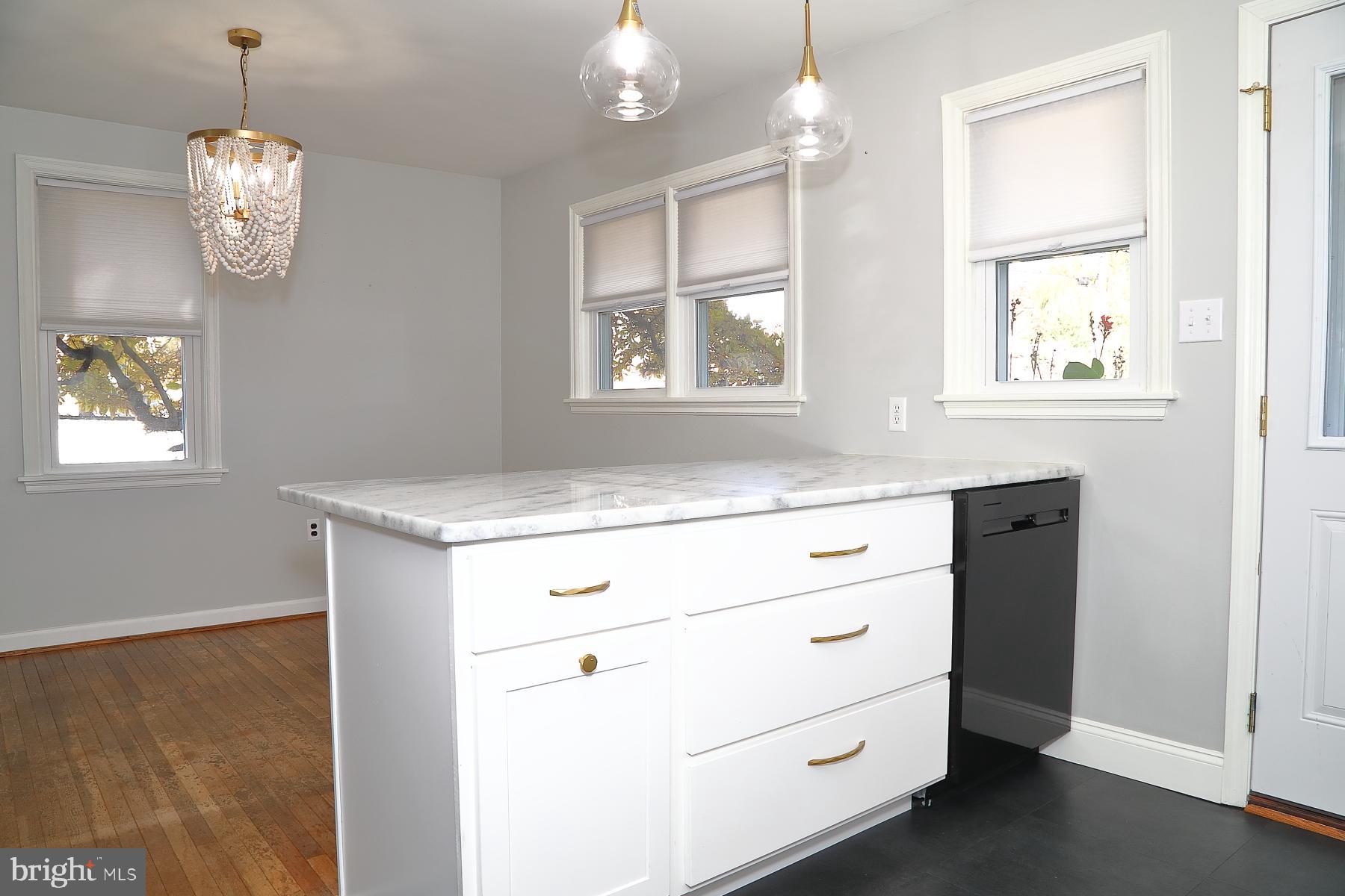 303 Euclid Avenue Lancaster, PA 17603 - Photo 6 of 24 an empty room with windows and wooden floor