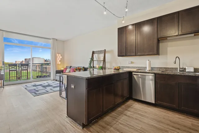 a kitchen with a sink stove and cabinets