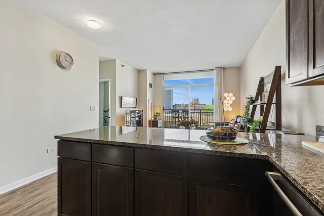 a kitchen with a sink and wooden cabinets
