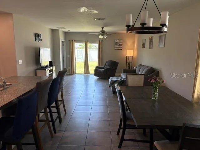 a dining room with furniture and window