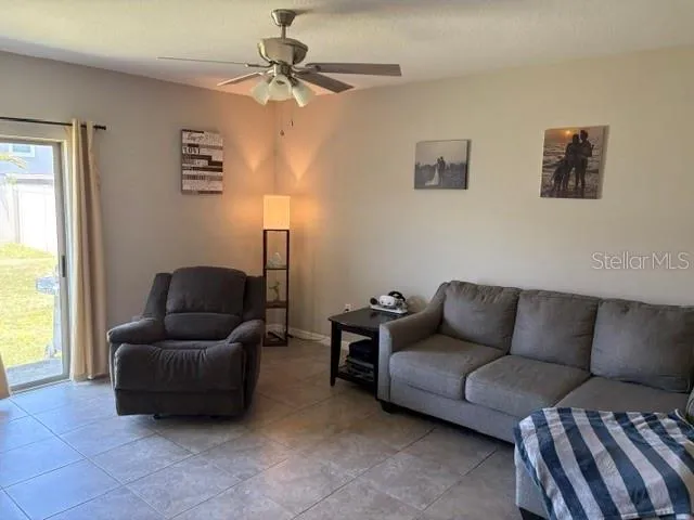 a living room with furniture and a window