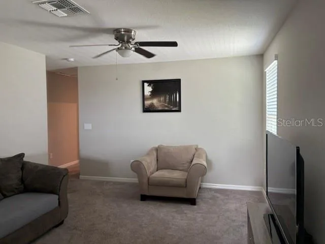 a bedroom with furniture and flat screen tv